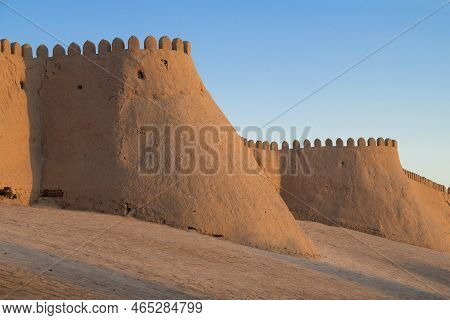 Fragment Of The Ancient Walls Of The Inner City Of Ichan-kala In The Light Of The Setting Sun. Khiva