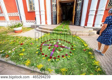 Entrance To An Orthodox Church Strewn With Flowers And Grass. Cathedral Of The Resurrection Of Chris