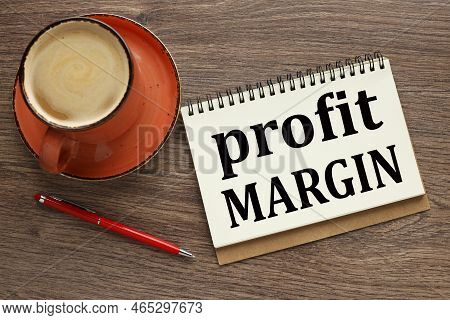 Profit Margin Concept. Businessman Plan. Profit Margin Growth Represented By Graph. Orange Cup Of Co