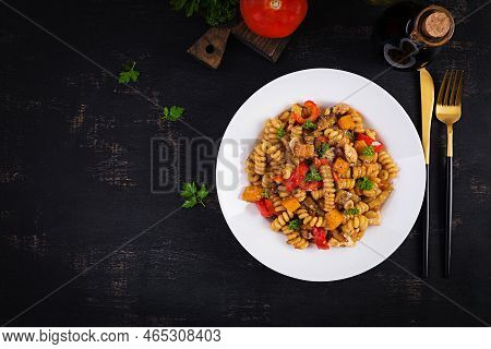 Vegetable Pasta Fusilli Corti Bucati With Eggplant, Sweet Pepper And Chicken In White Plate On Dark 