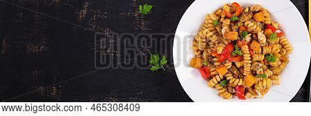 Vegetable Pasta Fusilli Corti Bucati With Eggplant, Sweet Pepper And Chicken In White Plate On Dark 