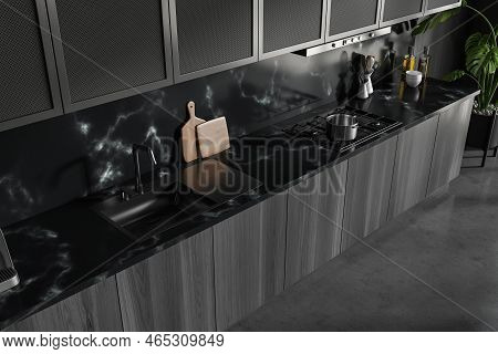 Close Up Top View On Dark Kitchen Room Interior With Grey Marble Wall, Concrete Floor, Sink, Gas Coo