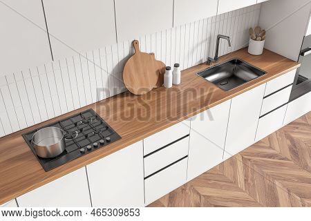 Close Up Top View On Bright Kitchen Room Interior With White Tile Wall, Hardwood Floor, Sink, Gas Co