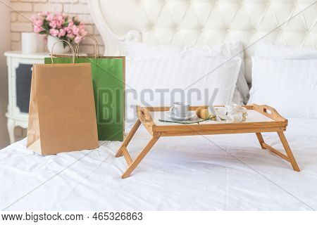 Delivery Food Craft Bag With Cup On The Bed On Sunny Day. Delivery In Any Weather Around The Clock T