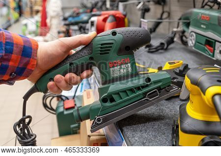 Bosch Orbital Sander. A Man In A Hardware Store Chooses A New Bosch Orbital Sander. Orbital Sander T