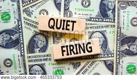 Quiet Firing Symbol. Concept Words Quiet Firing On Wooden Blocks. Beautiful Background From Dollar B