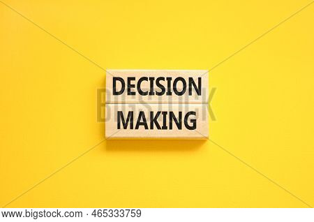 Decision Making Symbol. Concept Words Decision Making On Wooden Blocks. Beautiful Yellow Table Yello