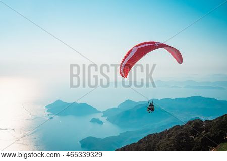 Paraglider Flying On Oludeniz Beach In Fethiye, Mugla. Travel Destination. Summer And Holiday Concep