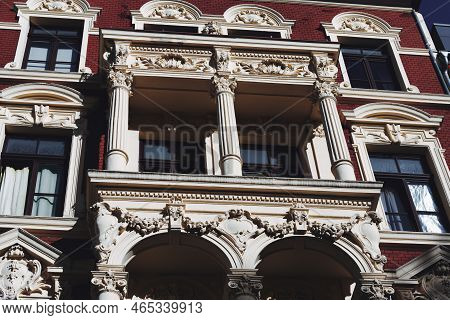 Historicist Facade With Decorated Balcony And Columns In The Belgian Quarter Of Cologne