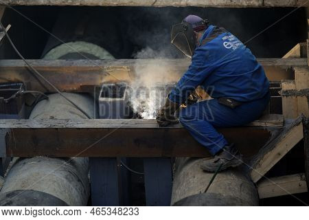 Bucharest, Romania - November 10, 2022: Details With A Professional Welder Welding An Industrial Met