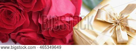 Gift Box For Valentine Day Tied With Golden Satin Ribbon Bow And Beautiful Roses. Nice Gifts For Wom