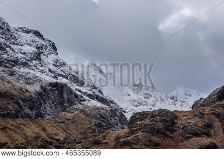 Epic Winter Landscape Image Of Snowcapped Three Sisters Mountain Range In Glencoe Scottish Highands 