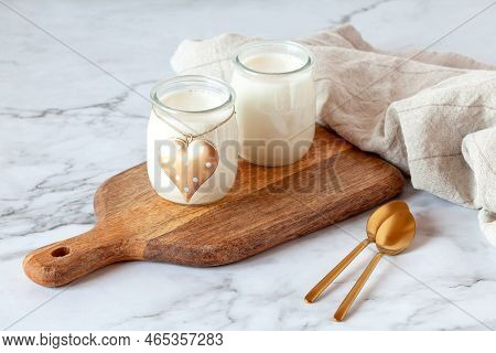 Two Portions Of Joghurt, Served On A Cutting Board, Valentine Day Breakfast Idea