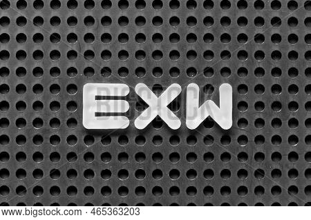 White Alphabet Letter In Word Exw (abbreviation Of Ex Works)  On Black Pegboard Background