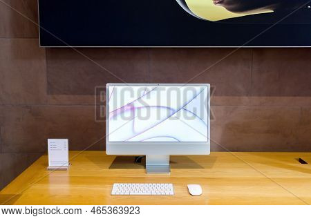 Paris, France - Oct 28, 2022: New Apple Computers Imac Computer Showing Random Wallpepr - M1 Cpu Sil