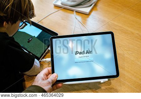 Paris, France - Oct 28, 2022: Male Hand Close-up Of New Apple Computers Ipad Air In Store - Looking 