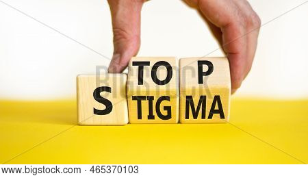 Stop Stigma Symbol. Concept Words Stop Stigma On Wooden Cubes. Businessman Hand. Beautiful Yellow Ta