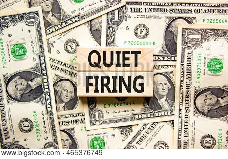 Quiet Firing Symbol. Concept Words Quiet Firing On Wooden Blocks. Beautiful Background From Dollar B