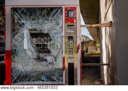 Lausanne, Vaud, Switzerland - 21 September, 2022: Damaged Selecta Vending Machine. Broken Glass. Vio