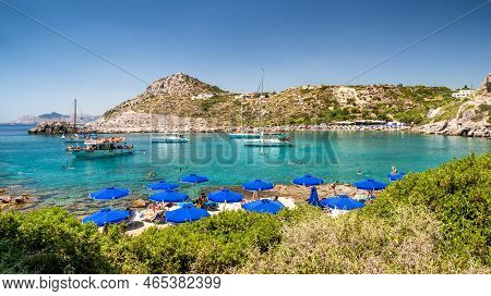 Faliraki, Greece - July 4, 2022: Crystal Clear Sea And Pebble Beach In Ladiko Beach In Rhodes Island