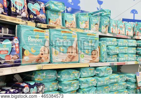 Moscow, Russia July 14, 2022: A Variety Of Packages With Diapers For Children. The Pampers On A Stor