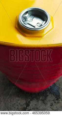 Top View Of Oil Drum Cover With A Little Oil Spill On The Ground.