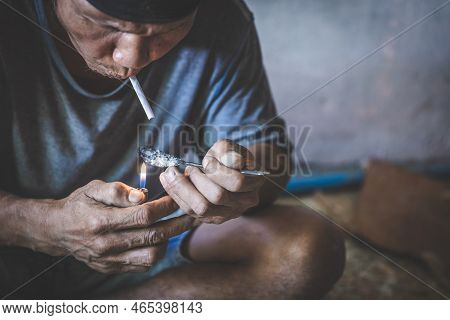 Addict Junkie Man Preparing Drugs. Man Taking Drugs, The Concept Of Crime And Drug Addiction. Heroin