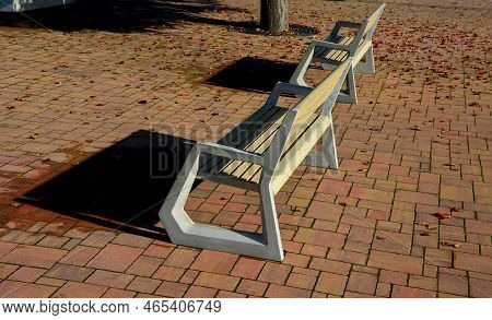 Light Concrete Park Bench, Elegant Cast Frame And Light Wooden Seat And Backrest Made Of Planks. Bro