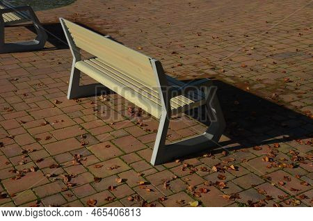 Light Concrete Park Bench, Elegant Cast Frame And Light Wooden Seat And Backrest Made Of Planks. Bro