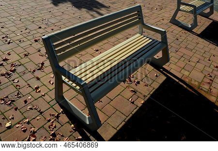 Light Concrete Park Bench, Elegant Cast Frame And Light Wooden Seat And Backrest Made Of Planks. Bro