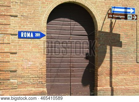 Italy, Tuscany: Road Signal ( Rome 201 Km, White Arrow, Francigena Road).