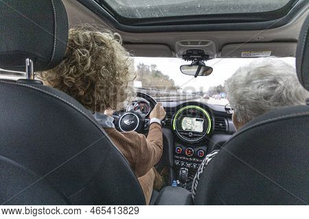 Duisburg, Germany - December 21, 2020: Mother Driving Car With Grandmother Sitting As Sozius In The 