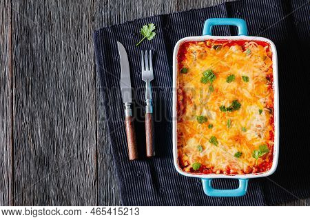Vegetarian Enchilada Casserole Layered With Tortillas, Sauce, Pinto Beans, Corn, Zucchini And Mexica