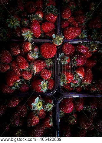 Strawberries In Plastic Containers. Fresh Berryes. Red And Dark
