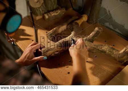 Female Using Power Wood Working Tools Graver, Carving While Crafting