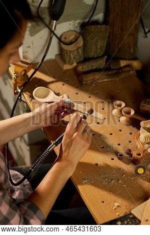 Female Using Power Working Tools Graver For Wooden Utensils Spoon