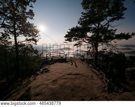 Full Moon And Sunset On Mountain. Misty Autumn Lightpainting In Cold Full Moon Light. Vilemina Rock,