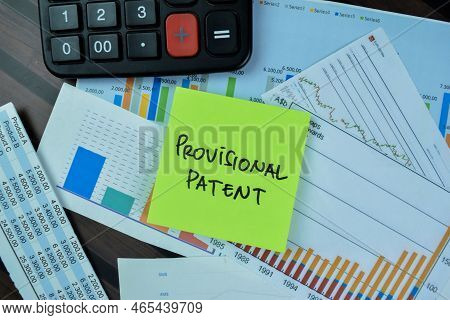 Concept Of Provisional Patent Write On Sticky Notes Isolated On Wooden Table.