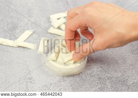 A Woman's Hand Takes Swedish Snus From A Box, Close-up