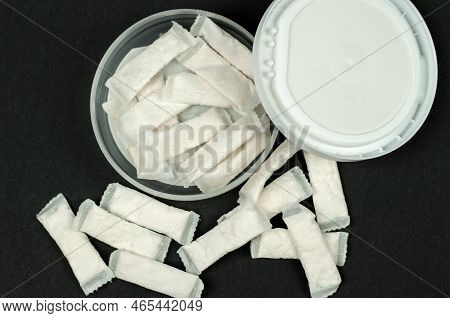 Open Box With Snus On A Black Background. Swedish Nicotine Sachets