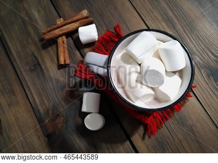Christmas Composition - Drink, Marshmello, Cinnamon And A Knitted Cup Stand. On The Wooden Table The