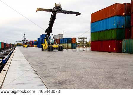 Forklift Handling Cargo Container. Freight Container Loading. Container Handler.  Logistics Import E