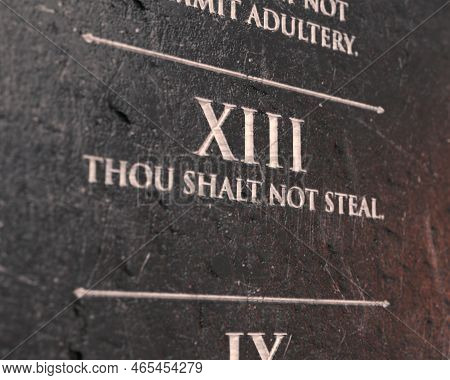 A View Of The Eight Commandment Etched Into A Cracked Stone Tablet On An Isolated Background - 3d Re