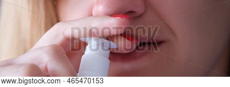 Woman Instilling Her Nose With Vasoconstrictor Drops Closeup. Acute Sinusitis Treatment Concept