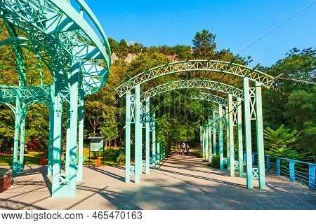 Borjomi, Georgia - September 01, 2021: Glass Pavilion Above Hot Spring Of Mineral Water In Borjomi C