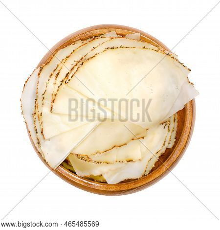 Sliced Pepper Cheese, Tranches In A Wooden Bowl. Extra Fine Sliced Soft Cheese, With A Covering Of A