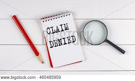 Claim Denied Text On A Notebook On White Wooden Background , Business Concept