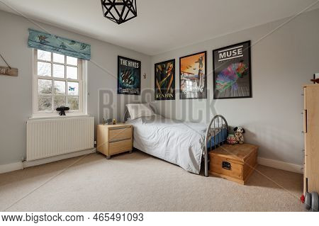 Fen Ditton, England - Jan 10 2019: Young Adult Or Teenagers Furnished Bedroom With Single Bed And Po