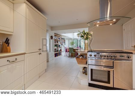 Fen Ditton, England - Jan 10 2019: Modern Open Plan Style Kitchen With Rangle Style Cooker Open To D