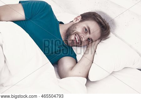 Experiencing A Supreme Pleasure. Single Man Smiling After Waking Up In Morning. Single Person Lying 